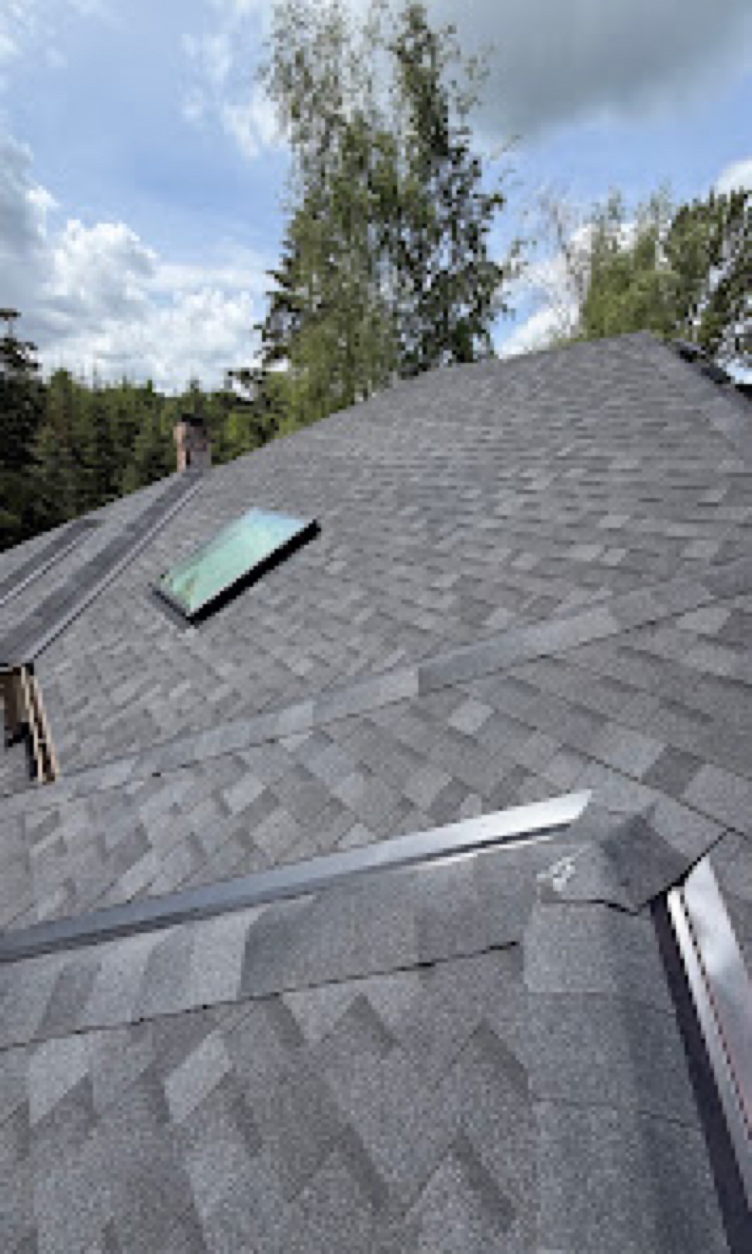 Valley and drip edge on a completed shingle roof