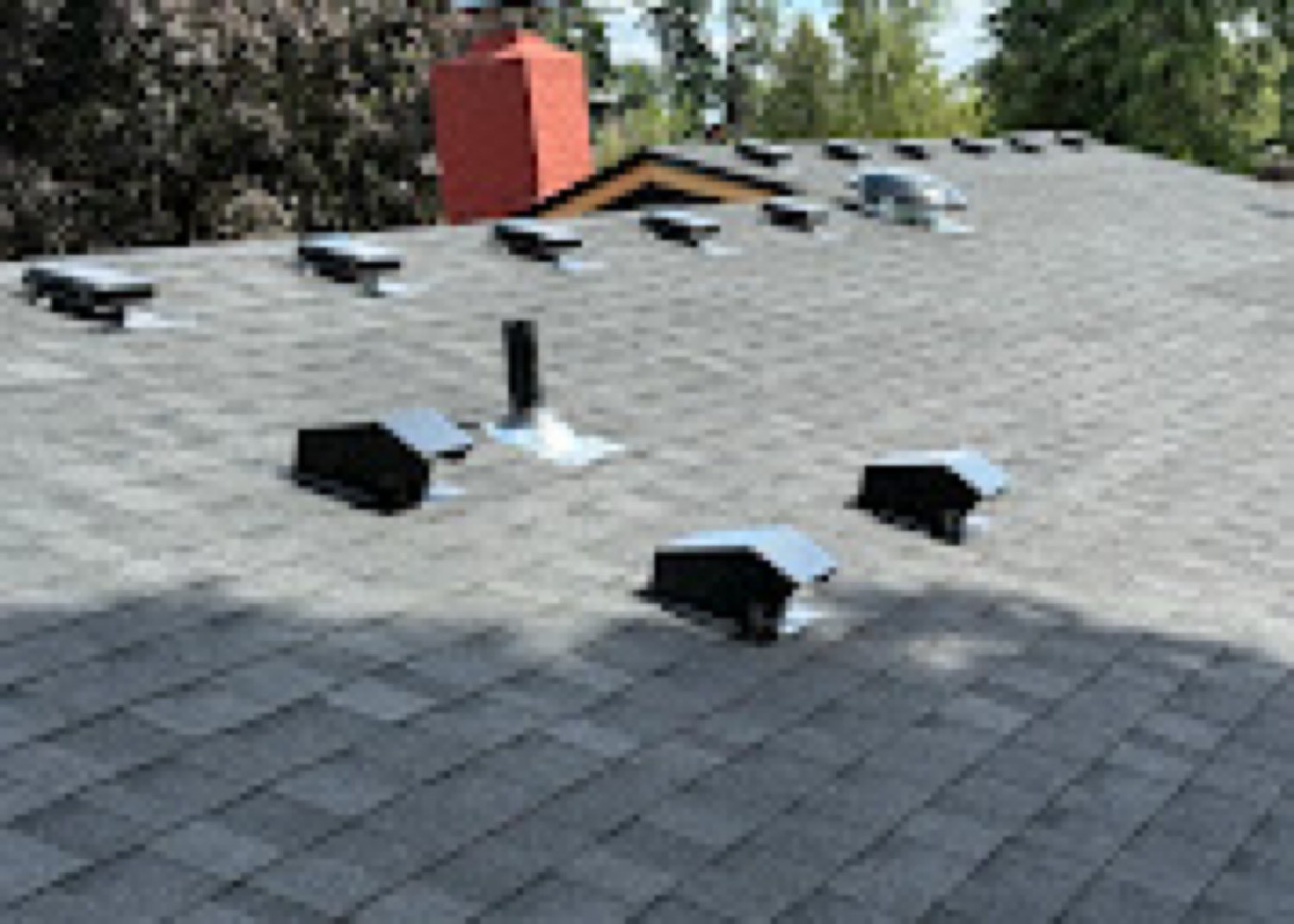 Roof vents and chimney flashing on a new shingle roof